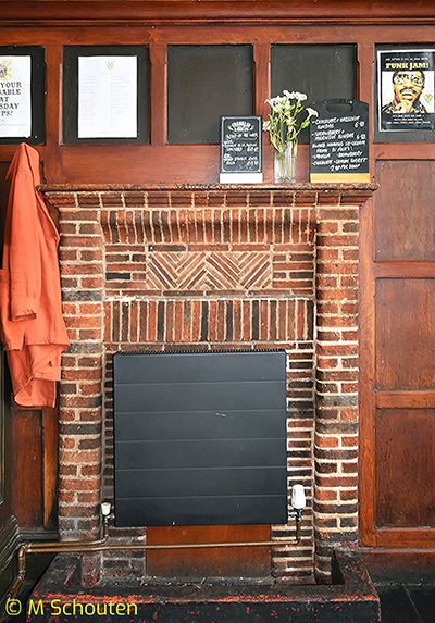 Fireplace in Left Hand Bar.  by Michael Schouten. Published on 